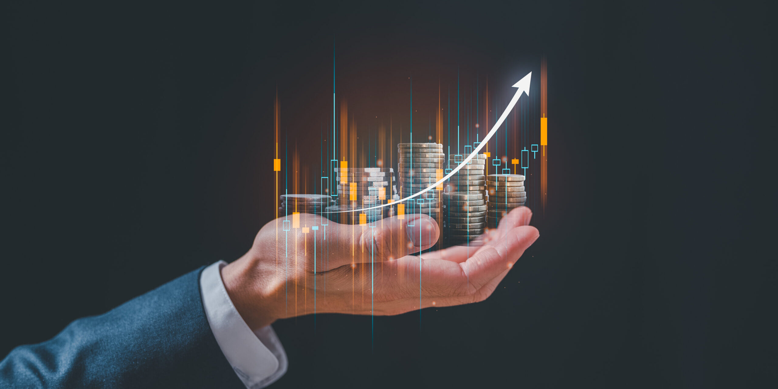 investment and finance concept, businessman holding virtual trading graph and blurred coins on hand, stock market, profits and business growth.